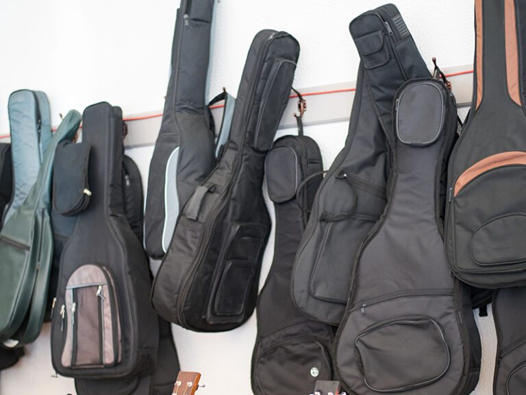 Guitar bags hanging on wall