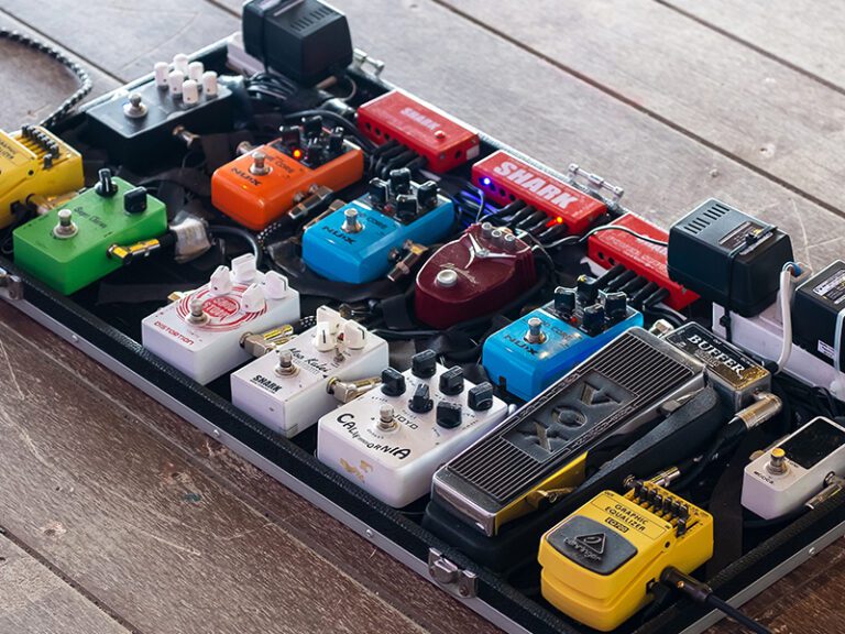 Guitar pedal board full of effect pedals
